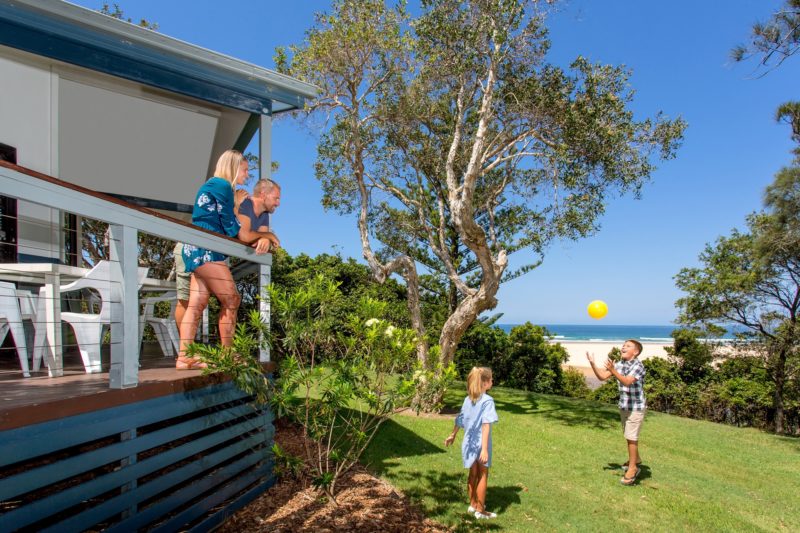 Family enjoying waterviews from cabin veranda at BIG4 Sawtell Beach Holiday Park
