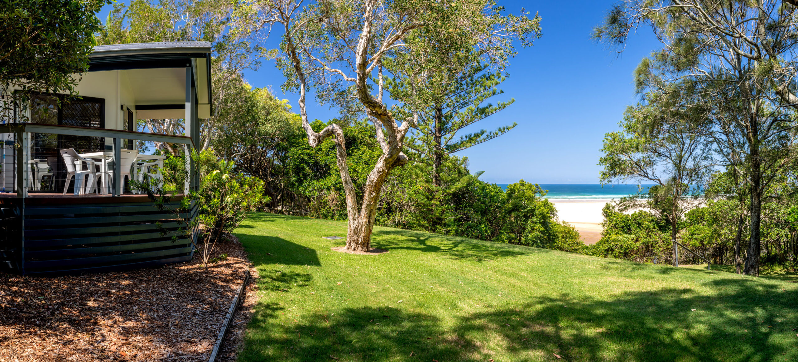 SB-Product-HERO-Villa-Cabin-veranda-grounds-1-small-1 Camping in Coffs Harbour