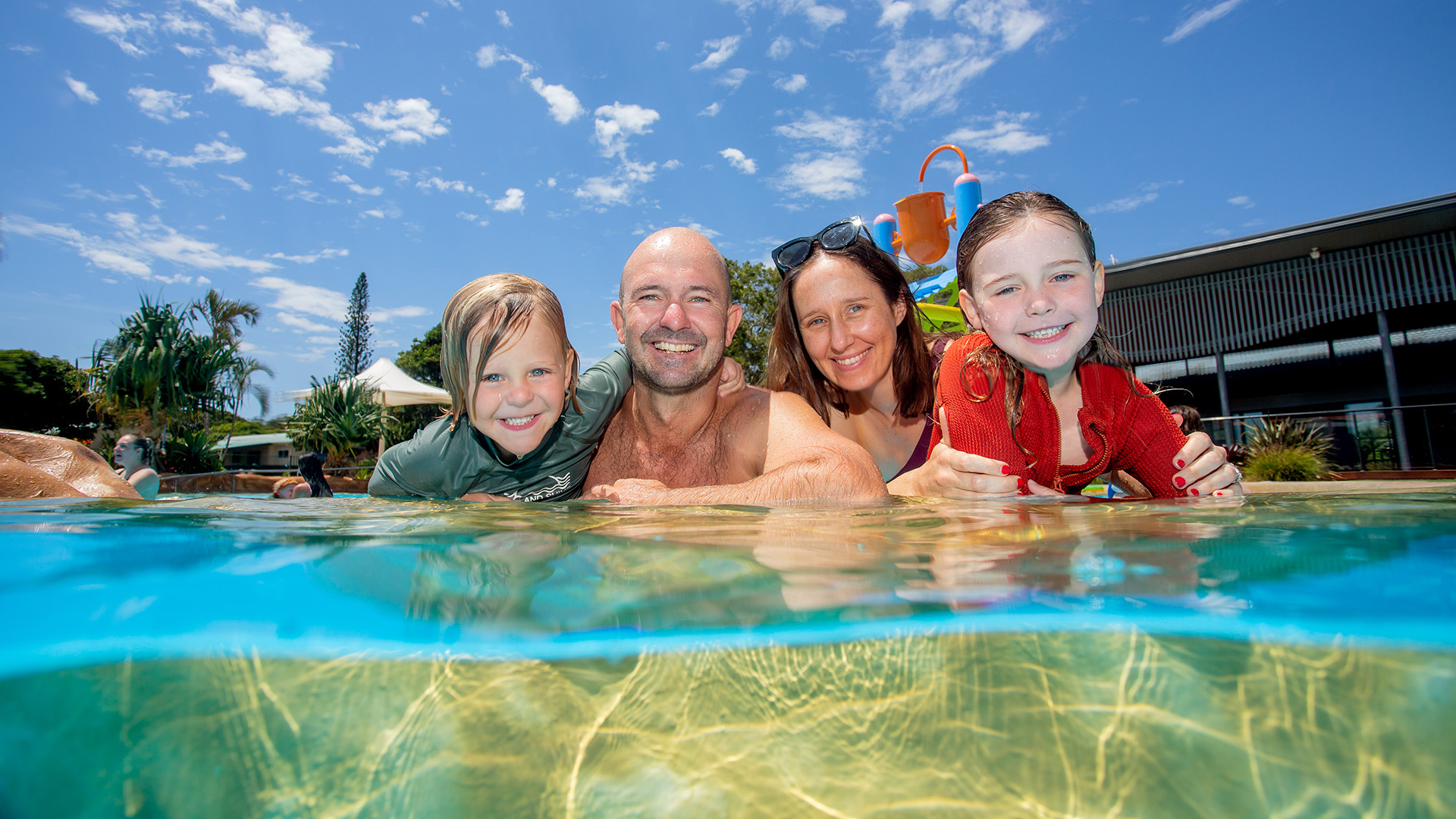 PB - Lifestyle - Pool - Family 02 - v2 - 1920 x 1080 POOL COFFS CARAVAN PARK