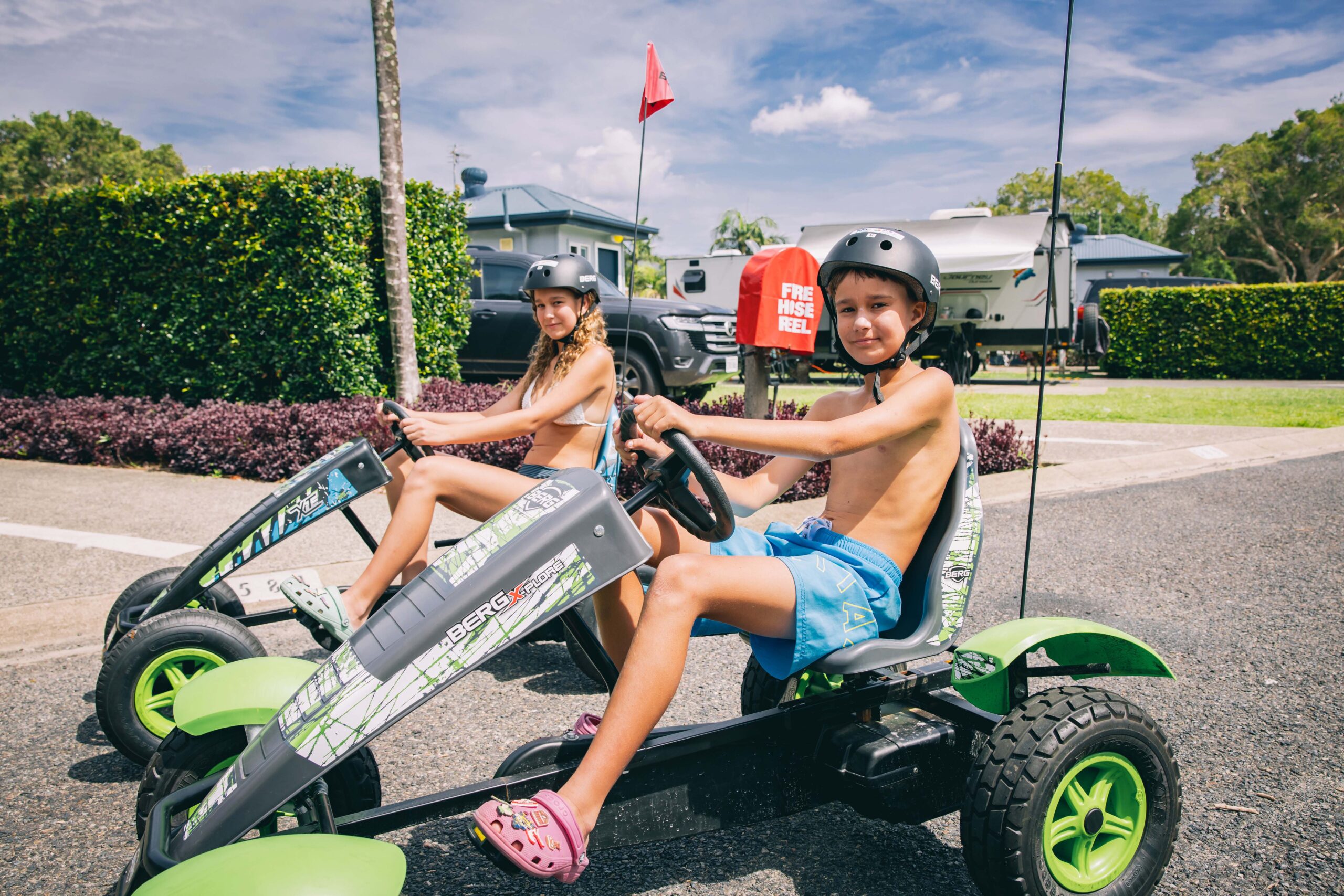 kids riding pedal karts